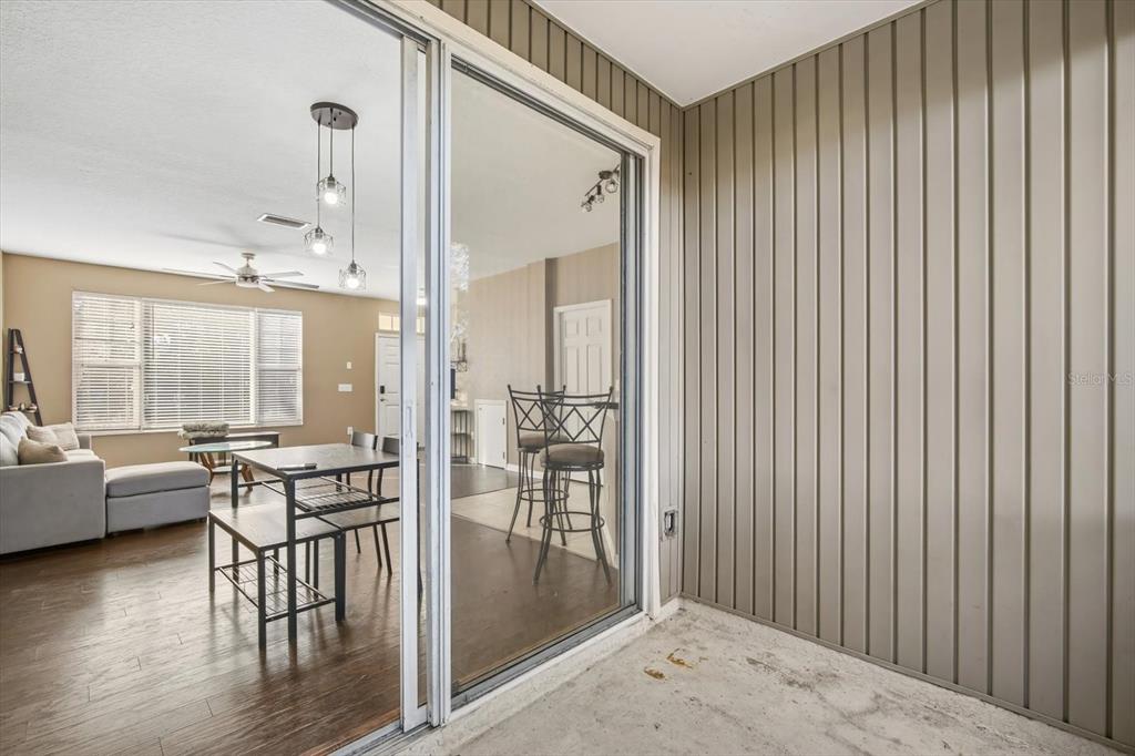 11008 Black Swan Court Seffner, FL 33584 - Photo 23 of 32 a very nice looking room with a large window and wooden floor