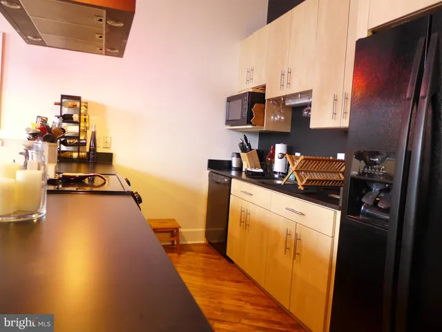 a view of a kitchen with appliances and cabinets