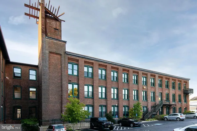 a front view of a building with street view and glass windows