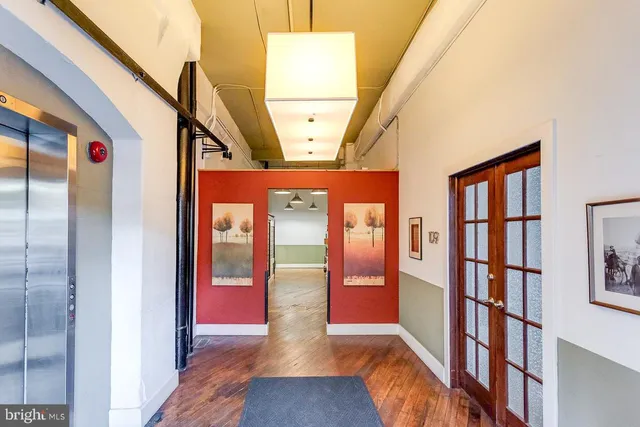 a view of an entryway with wooden floor