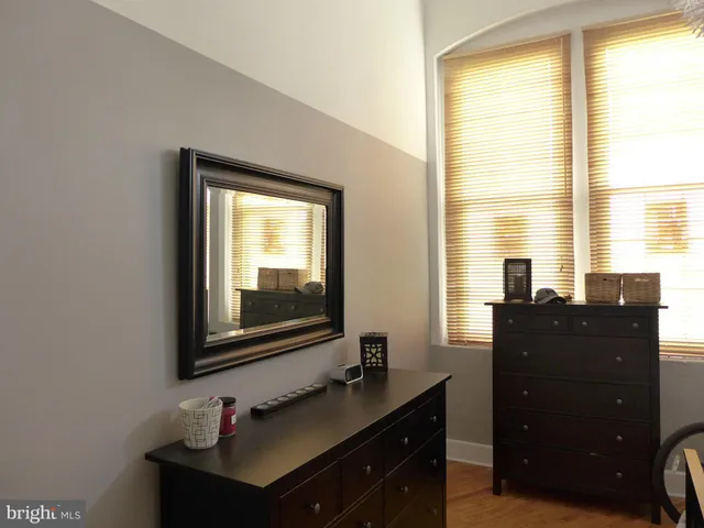 a bathroom with a sink vanity and a mirror