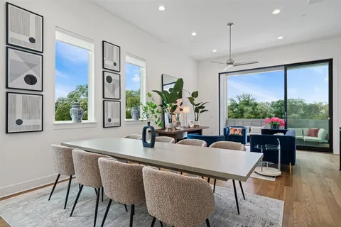 a dining room with furniture window and outside view
