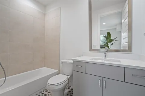 a bathroom with a sink a toilet and a bathtub