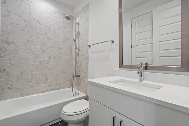 a bathroom with a sink a toilet and a bathtub