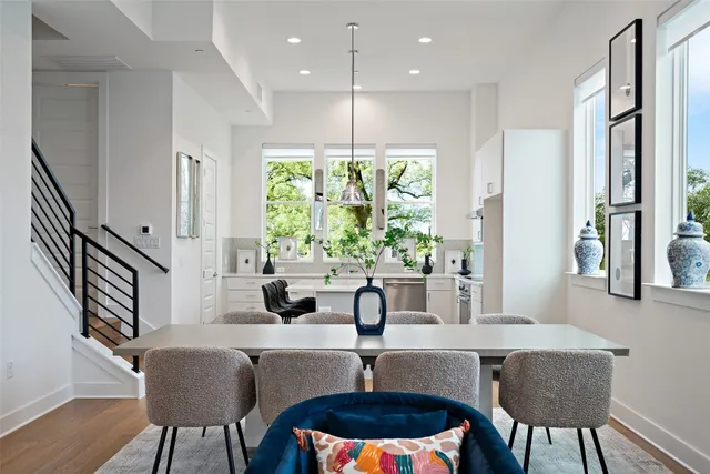 a dining room with furniture and window