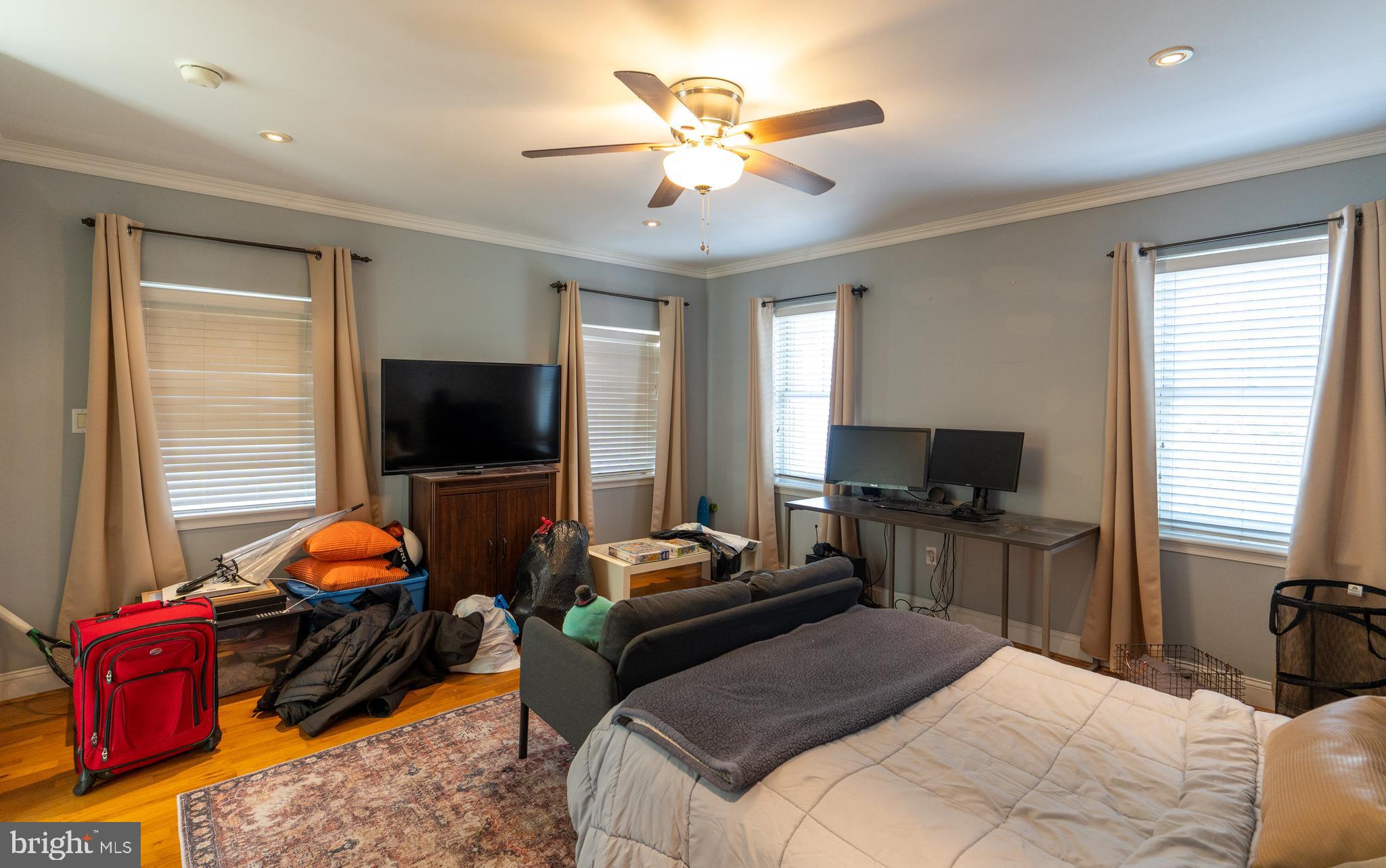 1108 Fitzwater Street Philadelphia, PA 19147 - Photo 11 of 25 a bedroom with a bed and flat screen tv