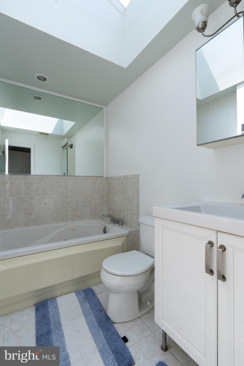 1108 Fitzwater Street Philadelphia, PA 19147 - Photo 13 of 25 a bathroom with a toilet a sink and bathtub