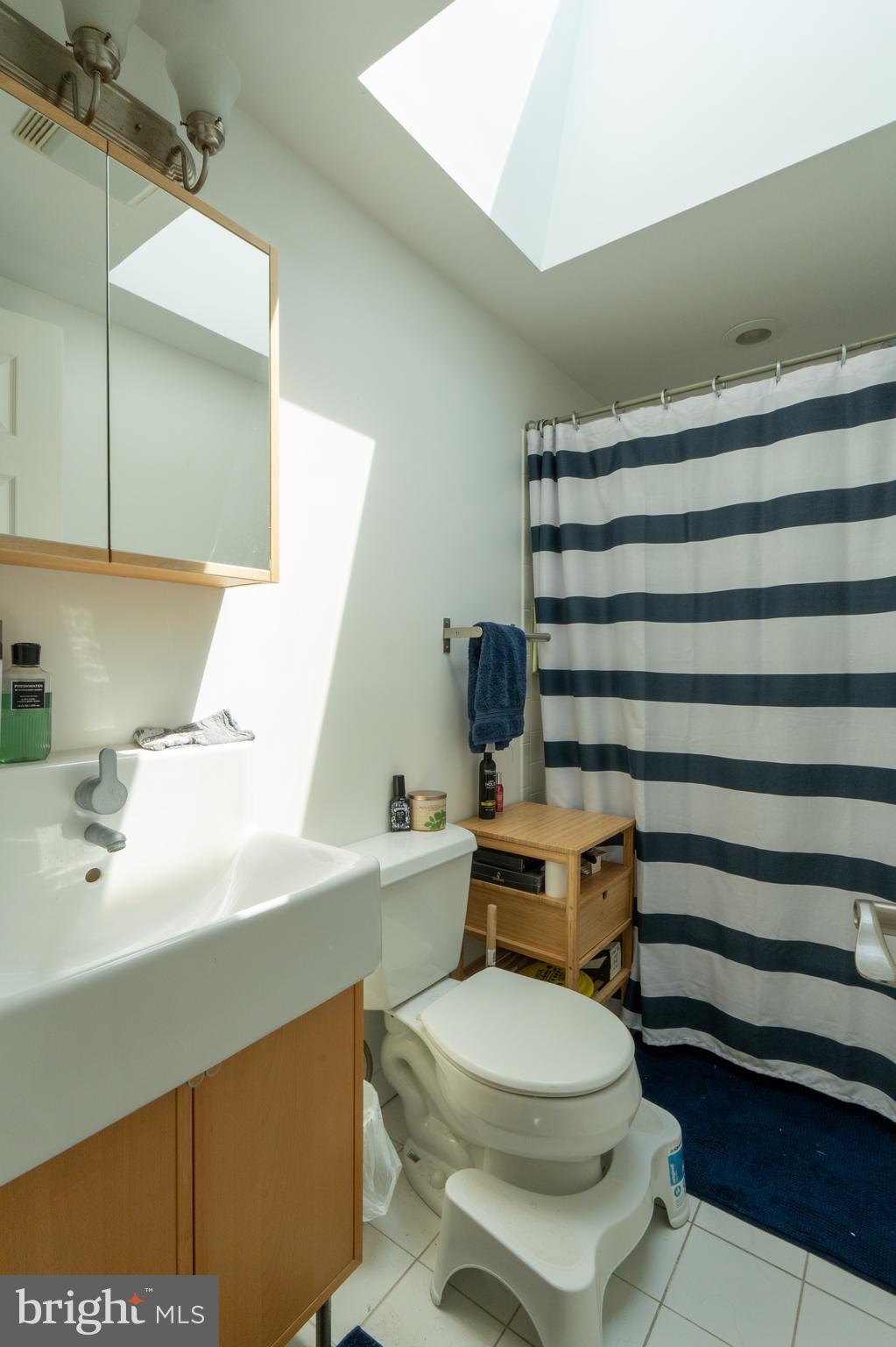 1108 Fitzwater Street Philadelphia, PA 19147 - Photo 14 of 25 a white toilet sitting next to a bathroom sink