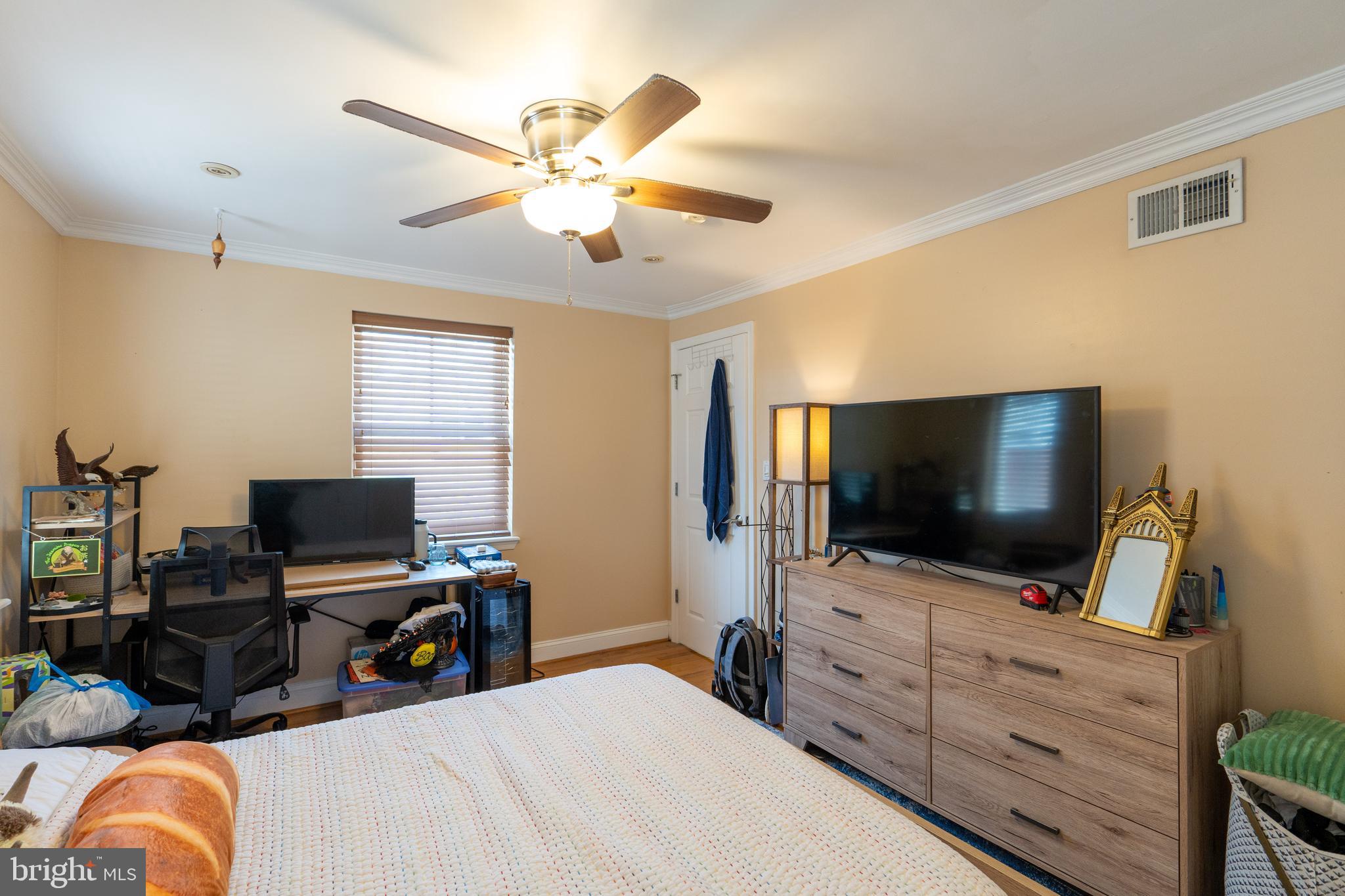 1108 Fitzwater Street Philadelphia, PA 19147 - Photo 16 of 25 a view of a livingroom with workspace and a flat screen tv
