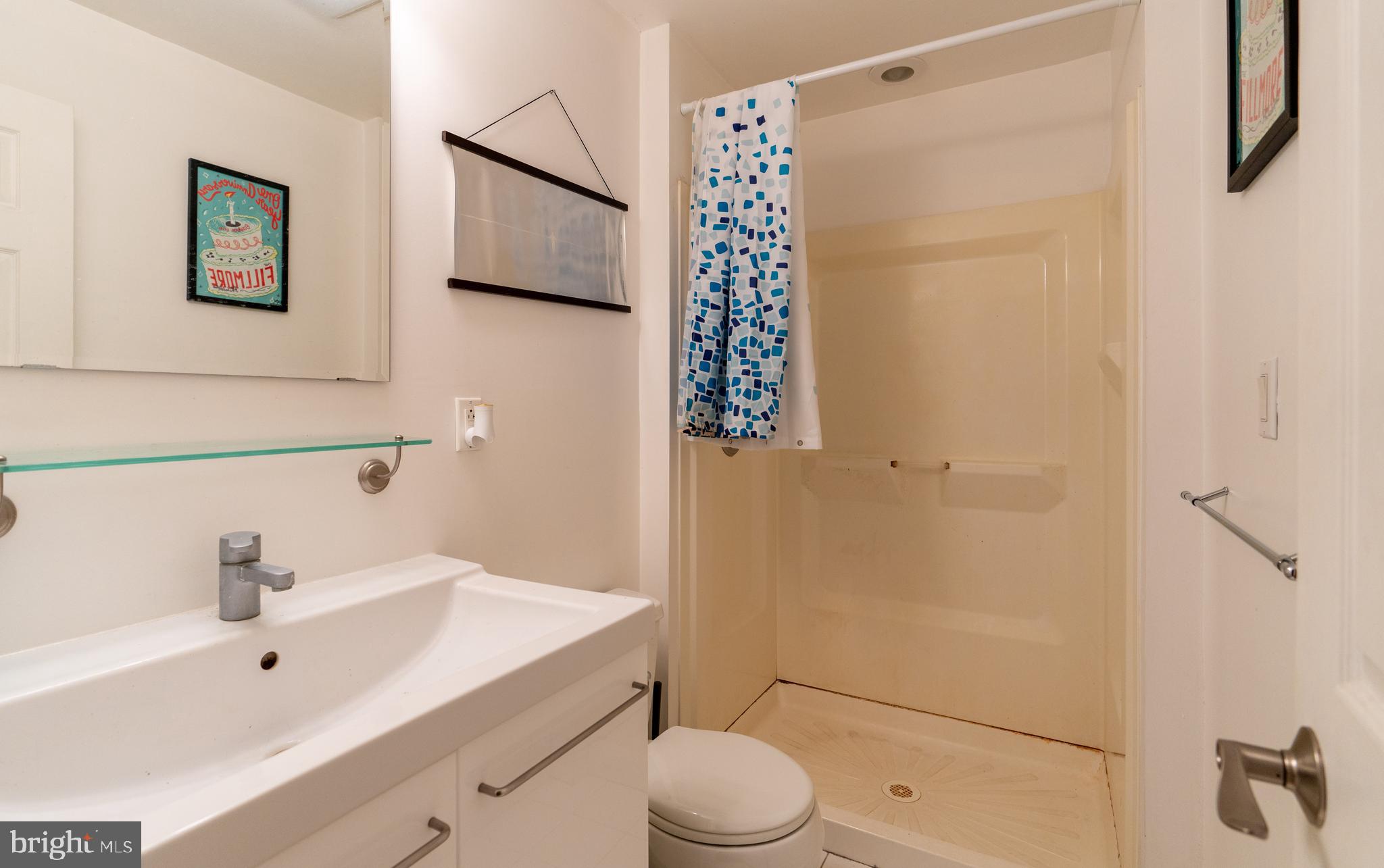 1108 Fitzwater Street Philadelphia, PA 19147 - Photo 20 of 25 a bathroom with a sink toilet and shower