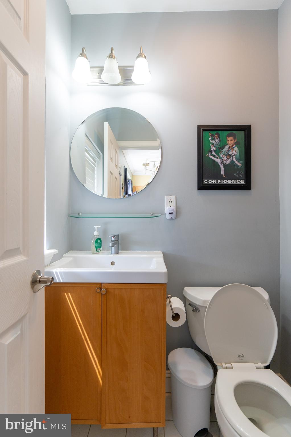 1108 Fitzwater Street Philadelphia, PA 19147 - Photo 25 of 25 a bathroom with a toilet a sink and mirror