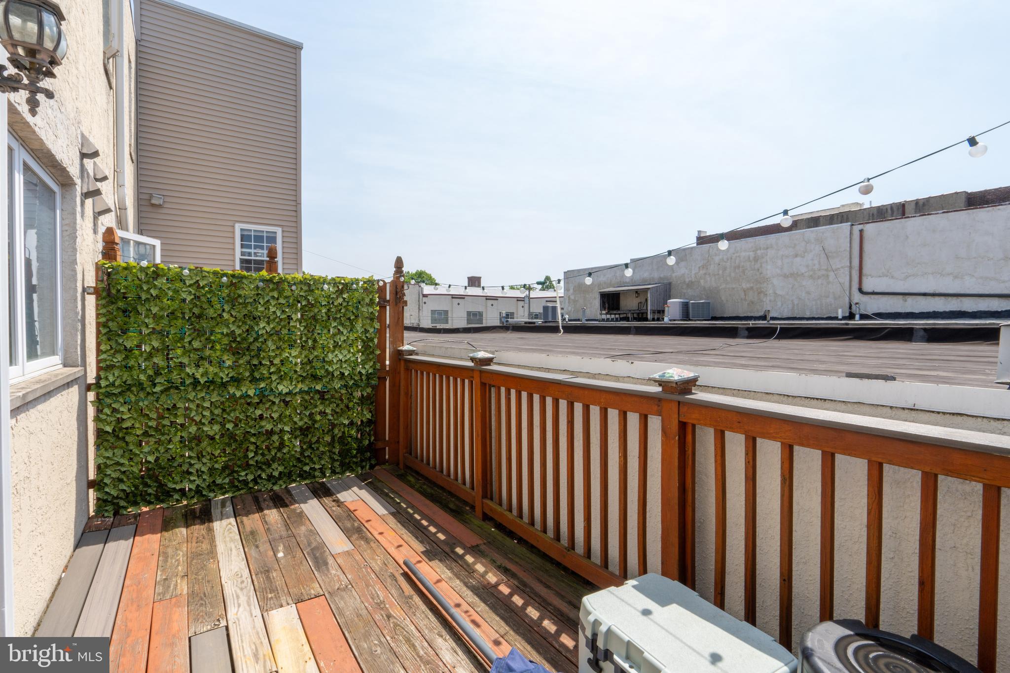 1108 Fitzwater Street Philadelphia, PA 19147 - Photo 7 of 25 a view of a balcony with wooden floor and fence