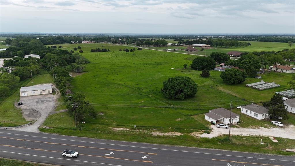 an aerial view of a golf course with parking space
