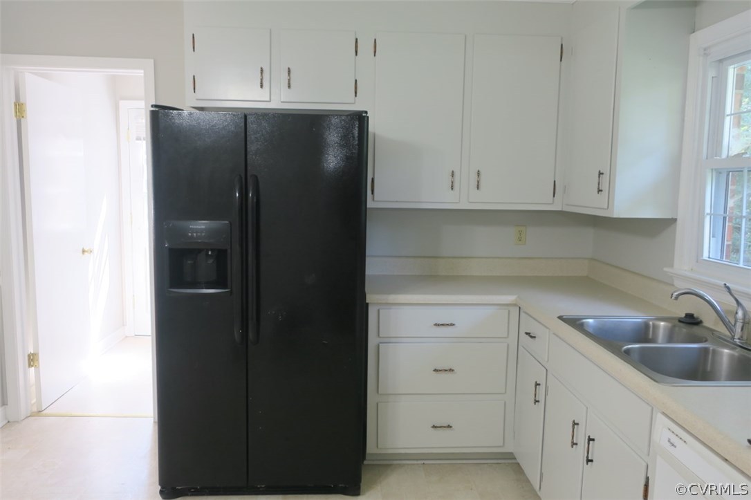 1218 Courthouse Road North Chesterfield, VA 23236 - Photo 27 of 30 a kitchen with a refrigerator and cabinets