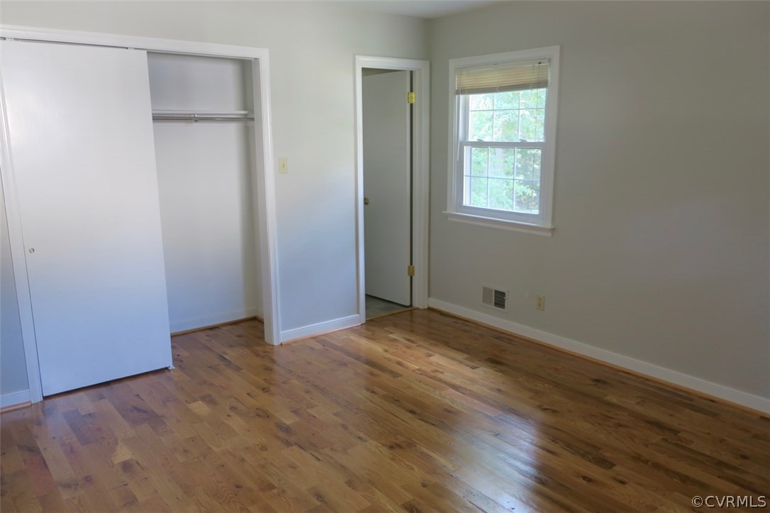 1218 Courthouse Road North Chesterfield, VA 23236 - Photo 8 of 30 a view of an empty room with wooden floor and a window