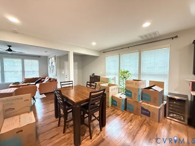 a view of a dining room with furniture window and wooden floor