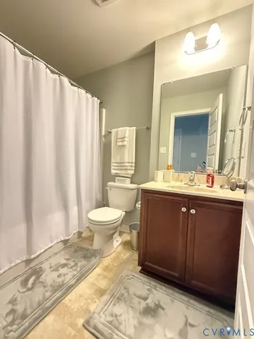 a bathroom with a sink vanity and a mirror