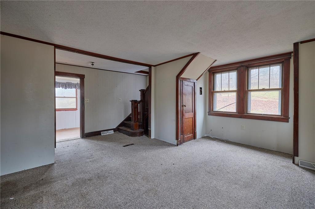 166 McCleary Road Aliquippa, PA 15001 - Photo 2 of 17 a view of an empty room with a window