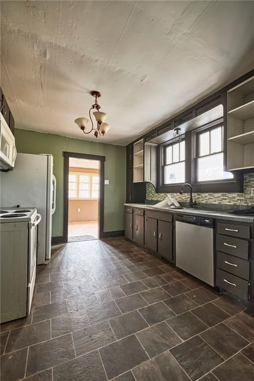 166 McCleary Road Aliquippa, PA 15001 - Photo 4 of 17 a large kitchen with a stove a sink dishwasher and a stove