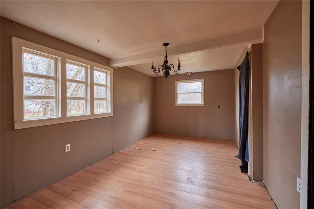 166 McCleary Road Aliquippa, PA 15001 - Photo 5 of 17 a view of an empty room with wooden floor and a window