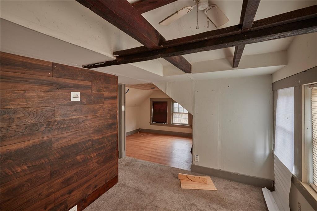 166 McCleary Road Aliquippa, PA 15001 - Photo 8 of 17 a view of a hallway with wooden floor and staircase