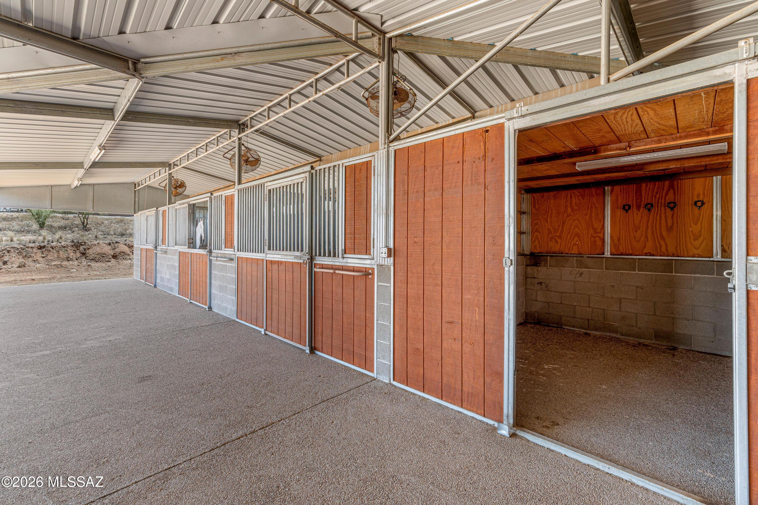 11160 East Golf Links Road Tucson, AZ 85730 - Photo 44 of 51 Tack room at the end of three of the stalls.