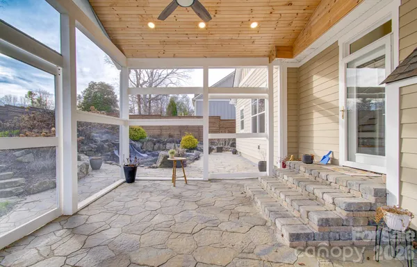 a view of a house with a yard and sitting area