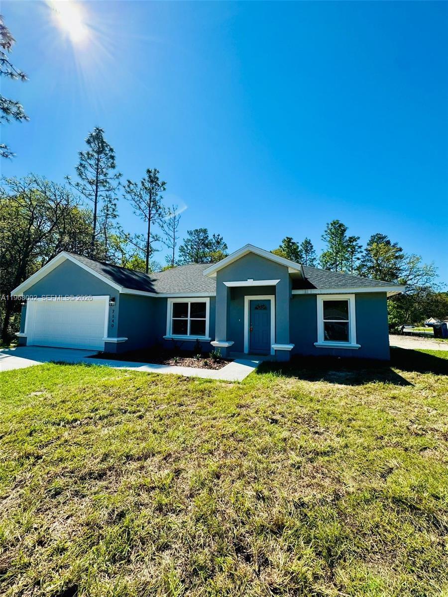 13731 Southwest 89 Circle Ocala, FL 34473 - Photo 1 of 24 a large house with a yard