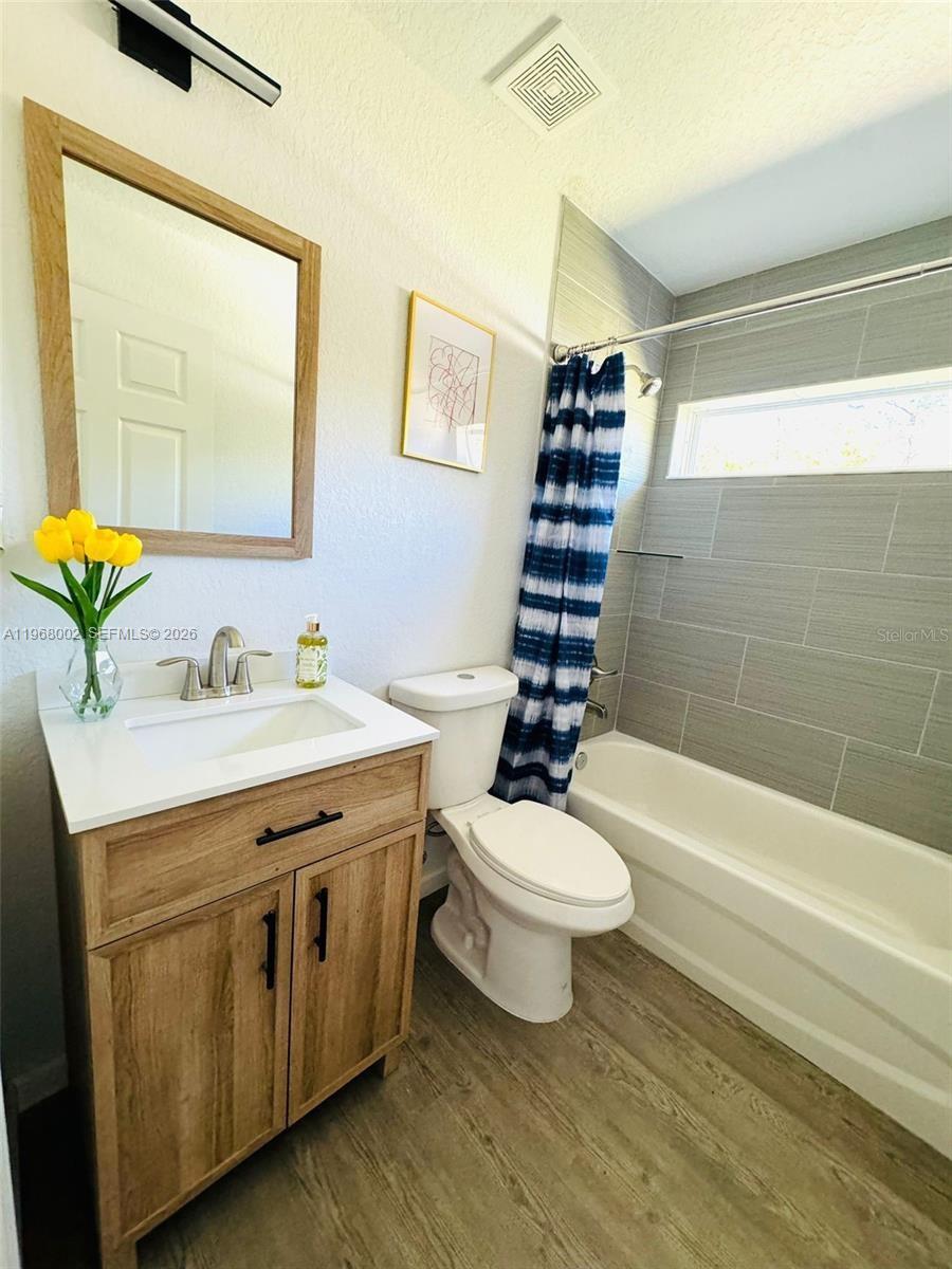 13731 Southwest 89 Circle Ocala, FL 34473 - Photo 19 of 24 a bathroom with a double vanity sink toilet and shower