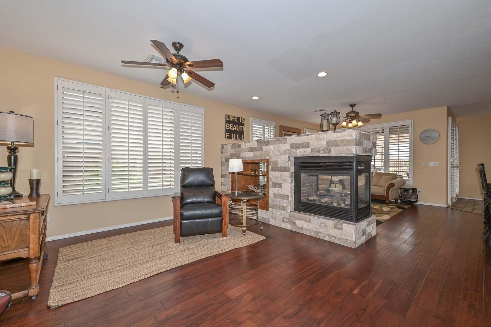 41418 North Clear Crossing Road Anthem, AZ 85086 - Photo 12 of 43 a living room with furniture and a fireplace