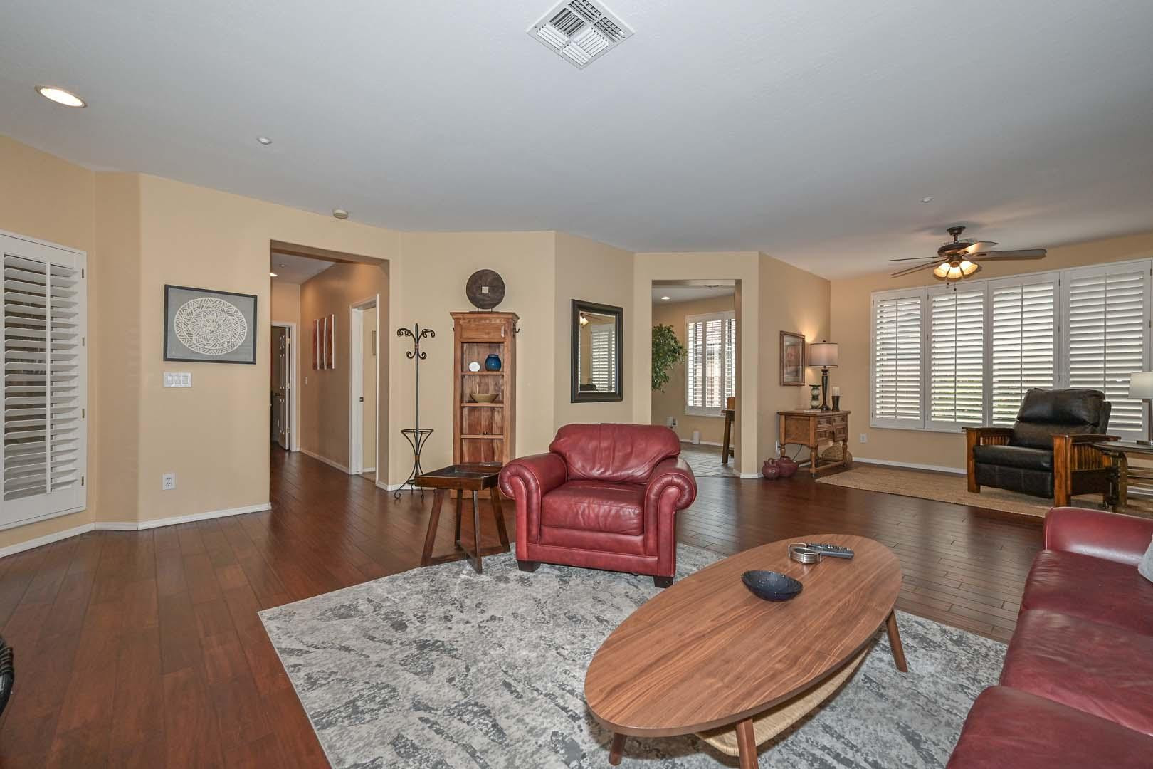 41418 North Clear Crossing Road Anthem, AZ 85086 - Photo 13 of 43 a living room with furniture rug and wooden floor
