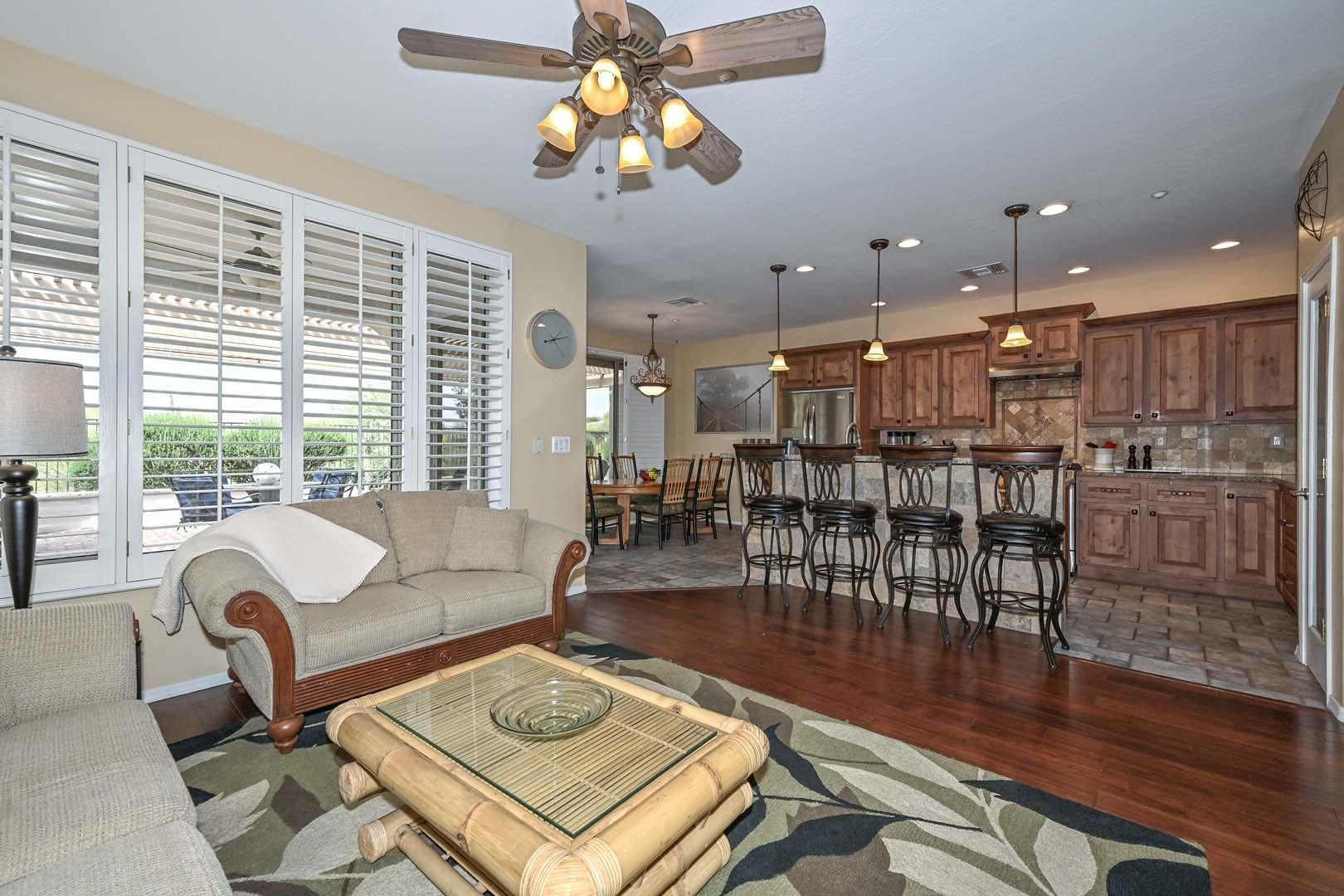41418 North Clear Crossing Road Anthem, AZ 85086 - Photo 16 of 43 a living room with lots of furniture and a wooden floor