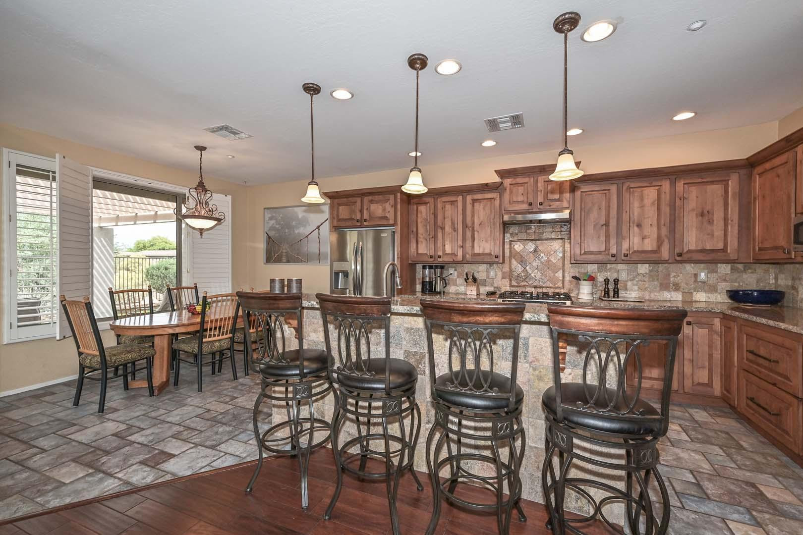 41418 North Clear Crossing Road Anthem, AZ 85086 - Photo 17 of 43 a view of a dining room with furniture window and wooden floor