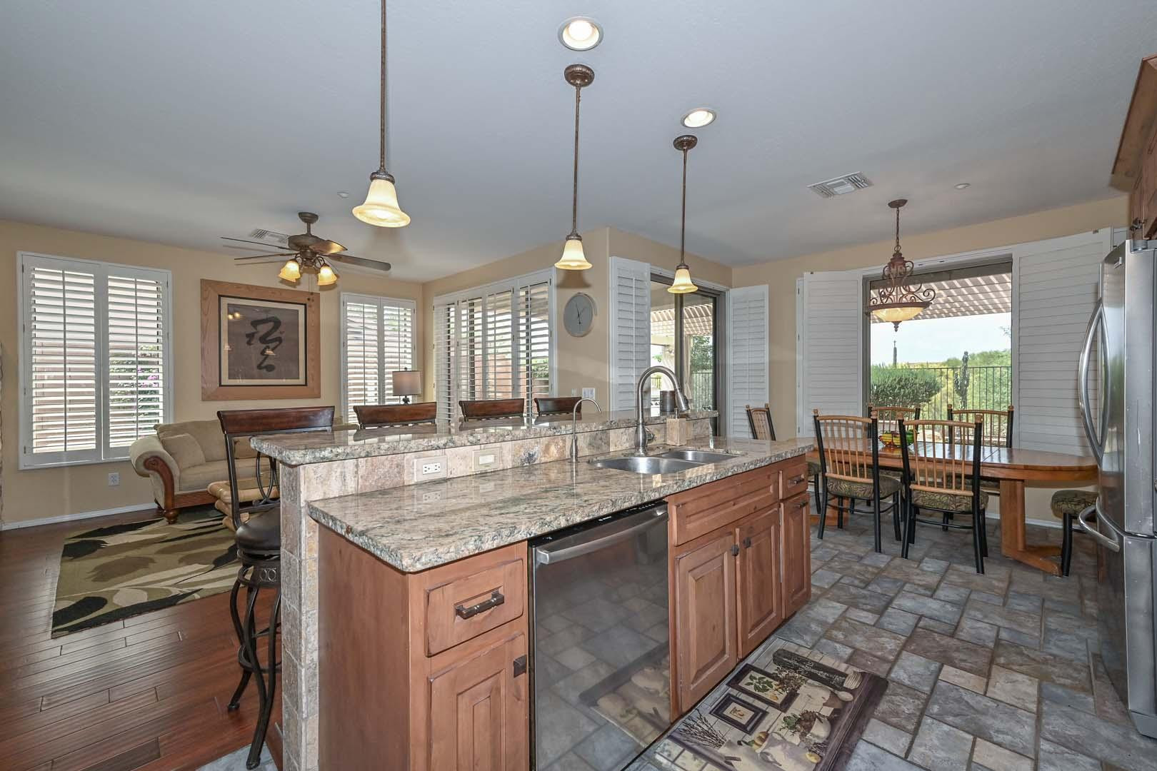 41418 North Clear Crossing Road Anthem, AZ 85086 - Photo 20 of 43 a kitchen with center island table and chairs
