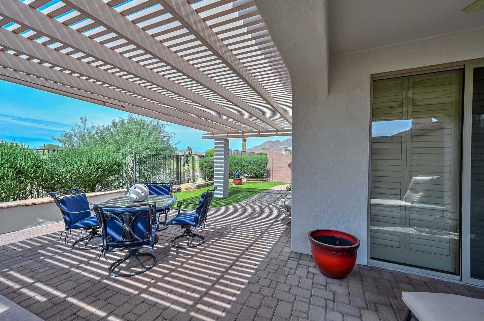 41418 North Clear Crossing Road Anthem, AZ 85086 - Photo 2 of 43 a view of a table and chairs in patio