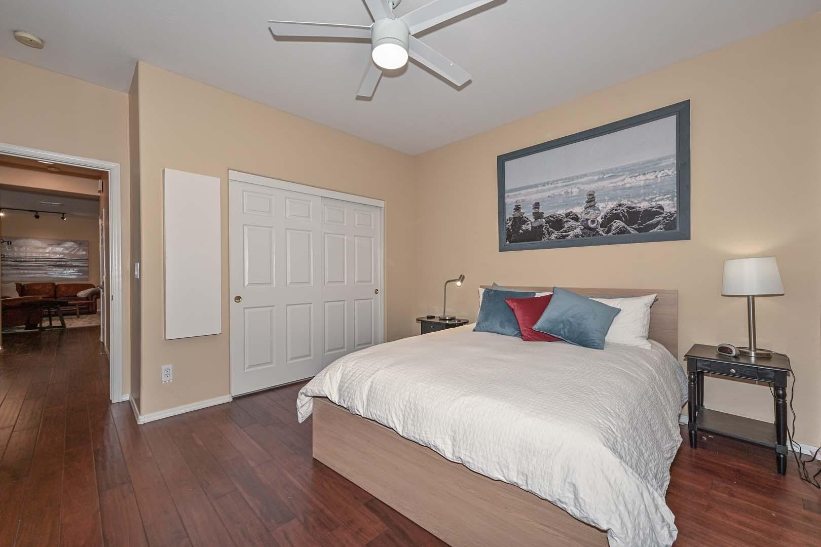 41418 North Clear Crossing Road Anthem, AZ 85086 - Photo 26 of 43 a bedroom with a bed and a painting on the wall