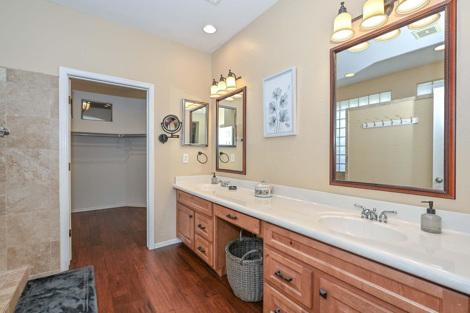 41418 North Clear Crossing Road Anthem, AZ 85086 - Photo 31 of 43 a spacious bathroom with a double vanity sink and a mirror