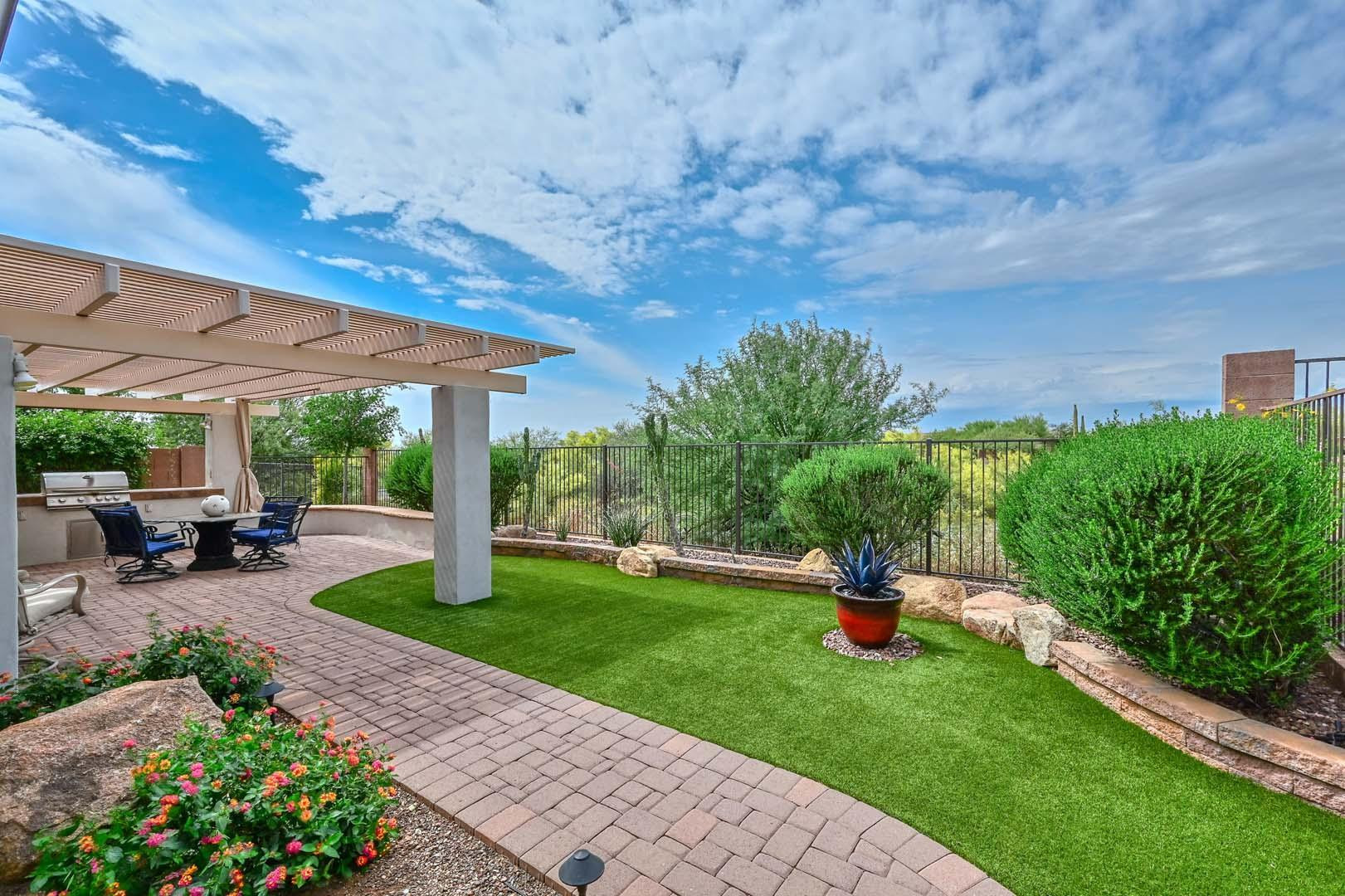 41418 North Clear Crossing Road Anthem, AZ 85086 - Photo 34 of 43 a view of a backyard with sitting area furniture and a garden