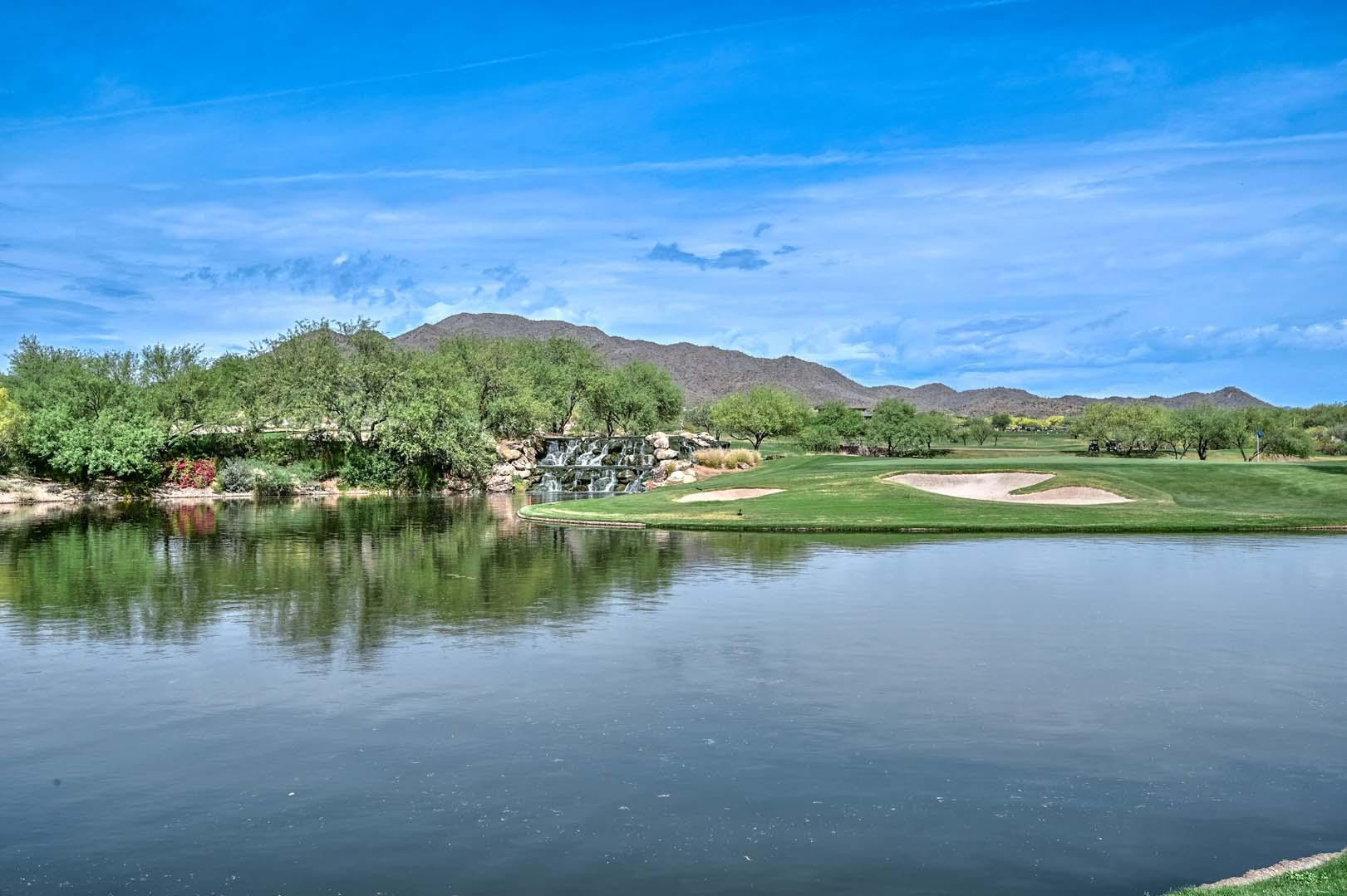 41418 North Clear Crossing Road Anthem, AZ 85086 - Photo 42 of 43 a view of a lake with houses in the back