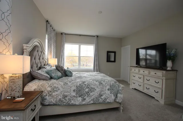 a bathroom with double sink and a mirror