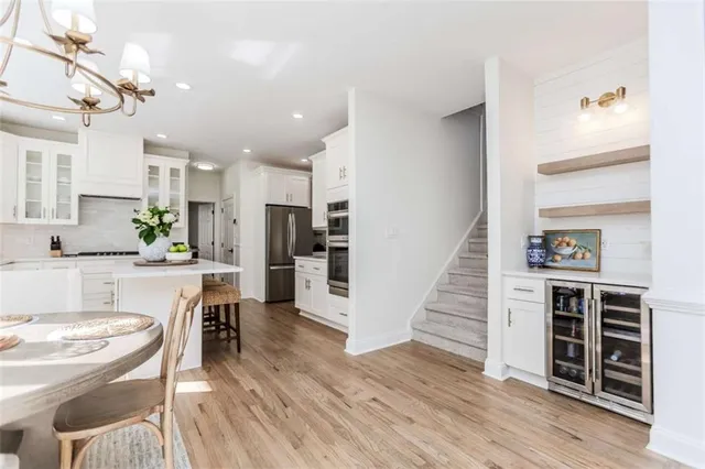 a view of kitchen with sink and wooden floor