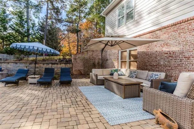 a view of a patio with couches and potted plants