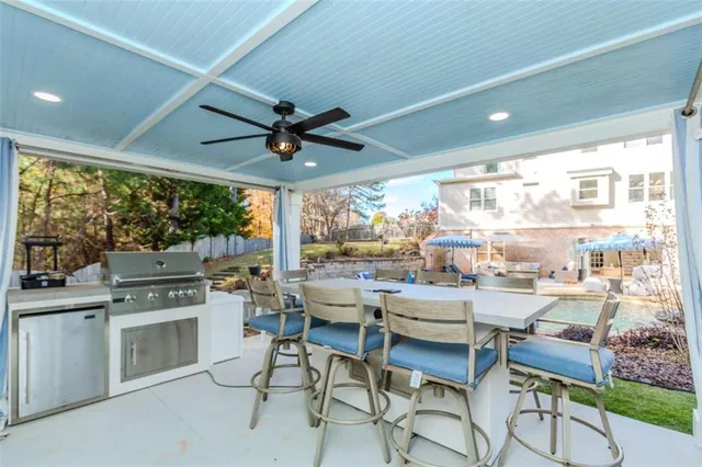 a room with lots of furniture and a large window