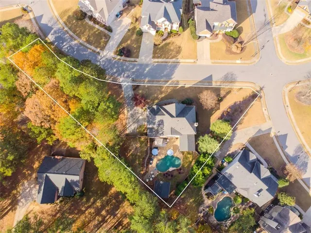 an aerial view of residential houses with outdoor space