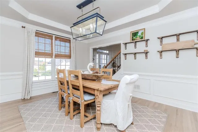 a view of a dining room with furniture and a window