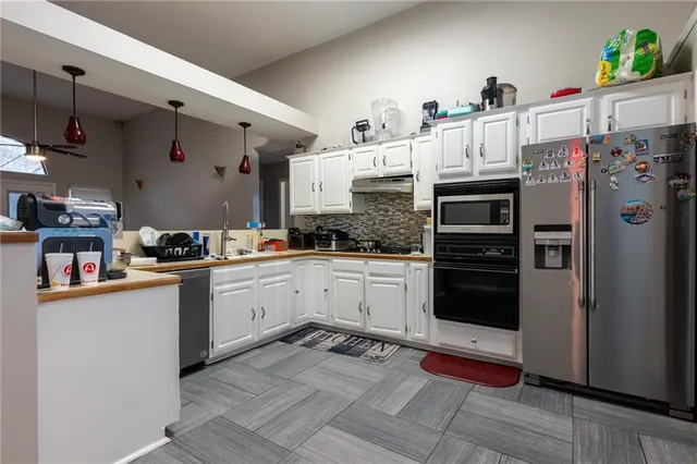 a kitchen with a sink cabinets and window