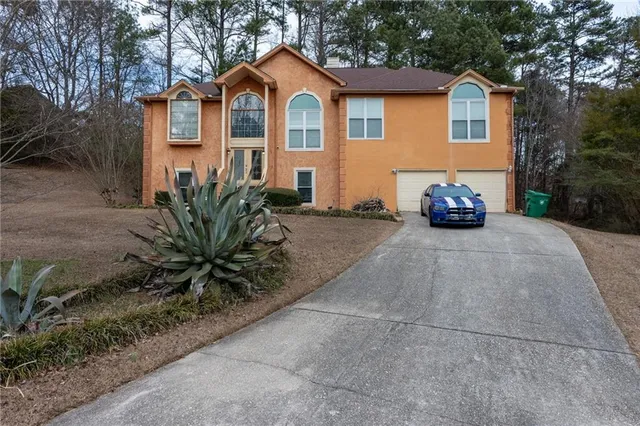 a front view of a house with garden