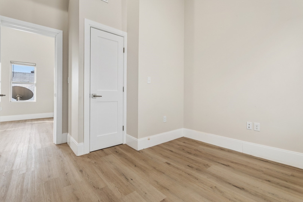 41 Wolcott Street, Unit 5 Everett, MA 02149 - Photo 16 of 22 a view of a room with wooden floor