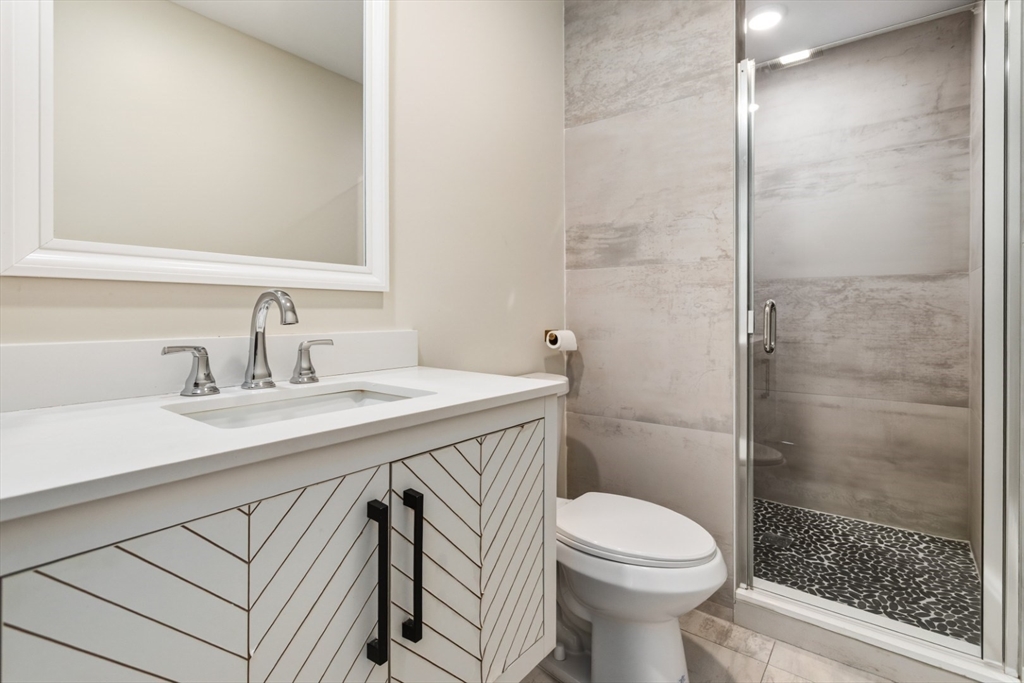 41 Wolcott Street, Unit 5 Everett, MA 02149 - Photo 18 of 22 a bathroom with a sink toilet and shower