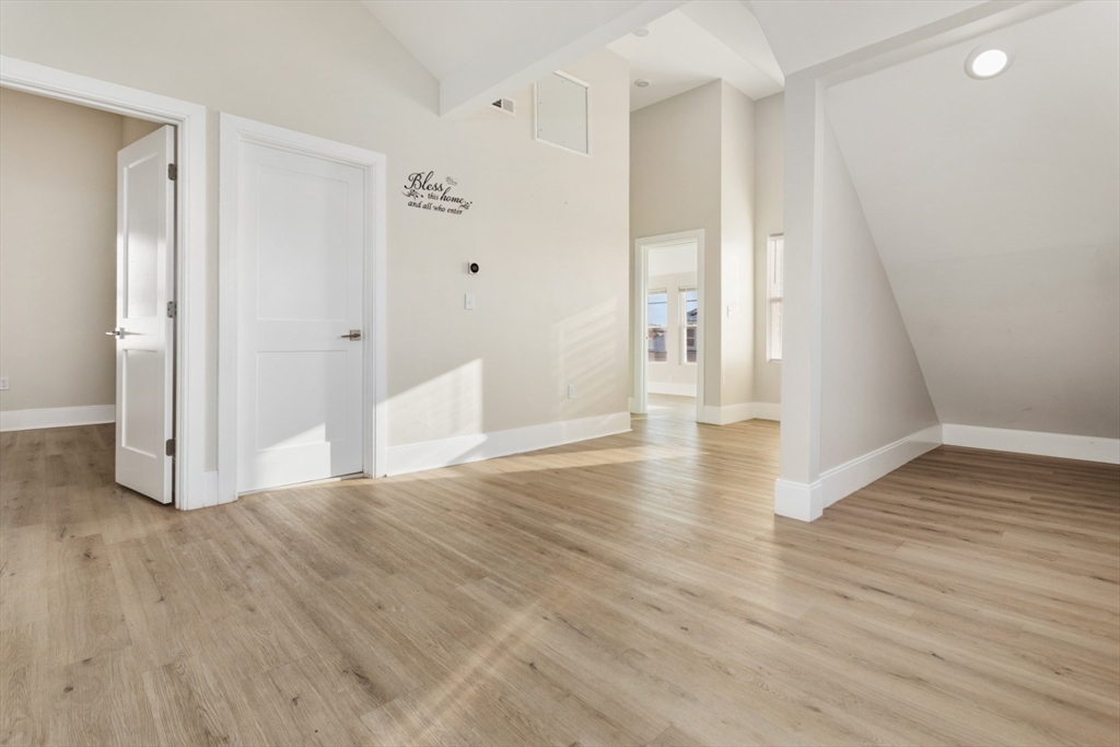 41 Wolcott Street, Unit 5 Everett, MA 02149 - Photo 2 of 22 a view of empty room with wooden floor